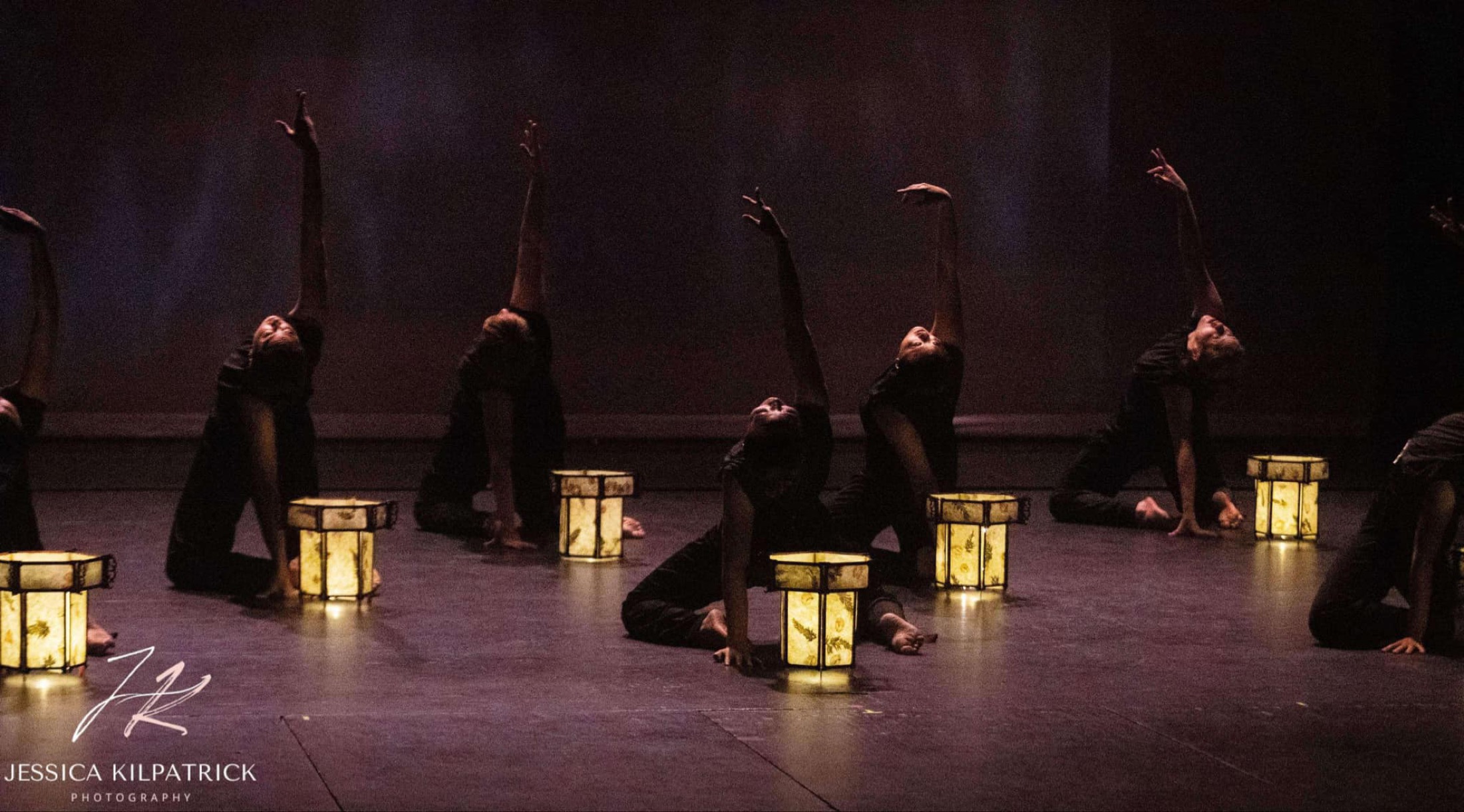 MiYoung Margolis Dance Collective performing onstage with illuminated lanterns.